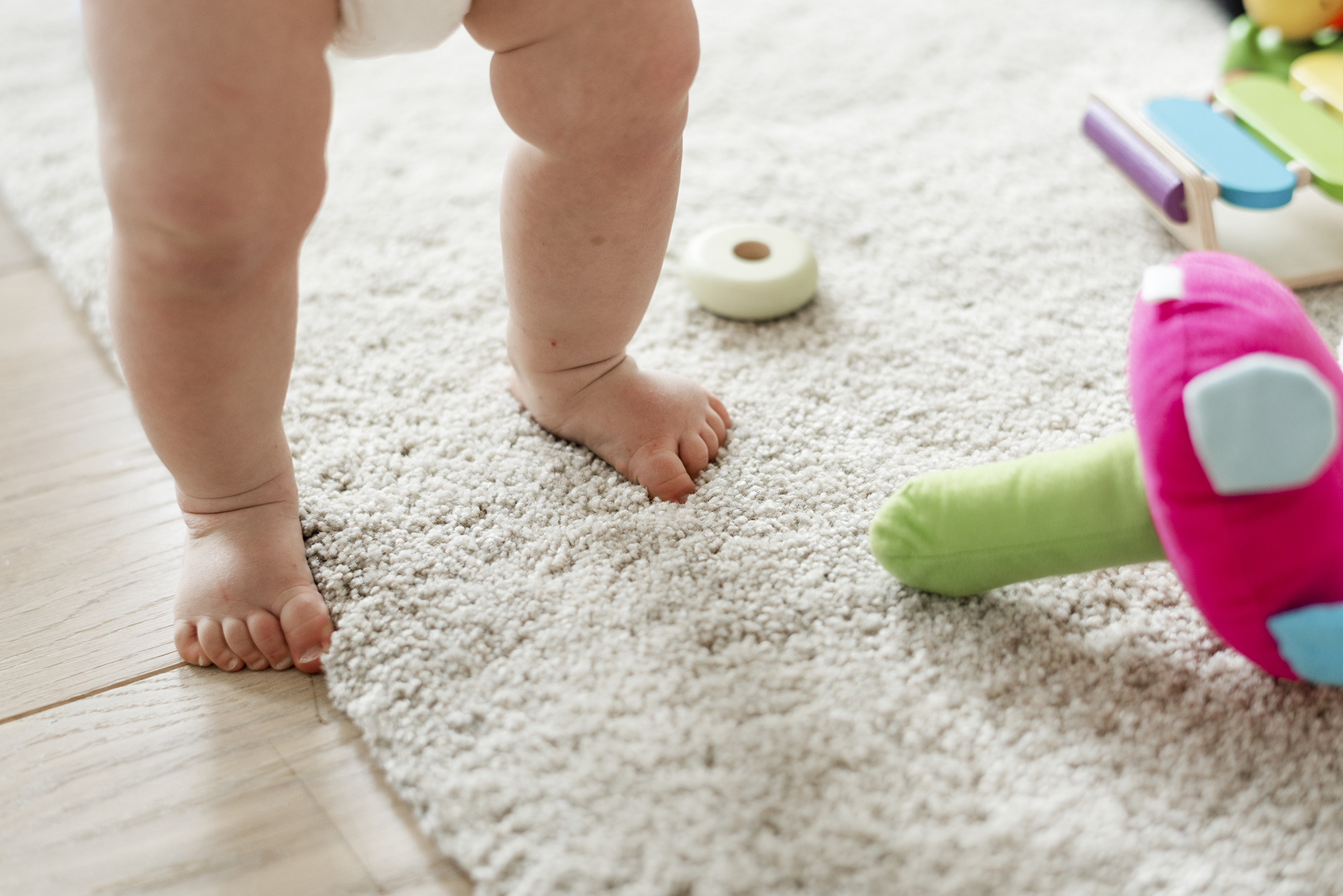 Closeup of baby's legs while standing